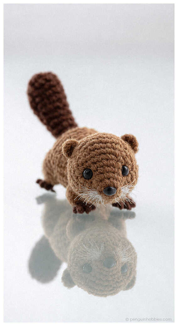 Free Beaver Amigurumi Pattern idea: A tiny crochet beaver with a scarf, perfect for a DIY holiday gift.