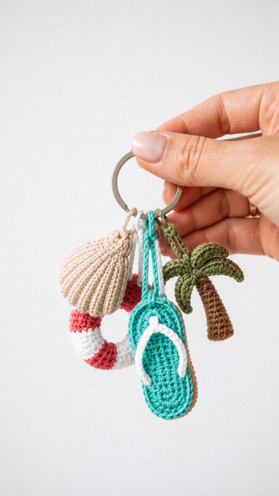Beach day keychain set crochet pattern with seashell, lifebuoy, flip-flop, and palm tree charms
