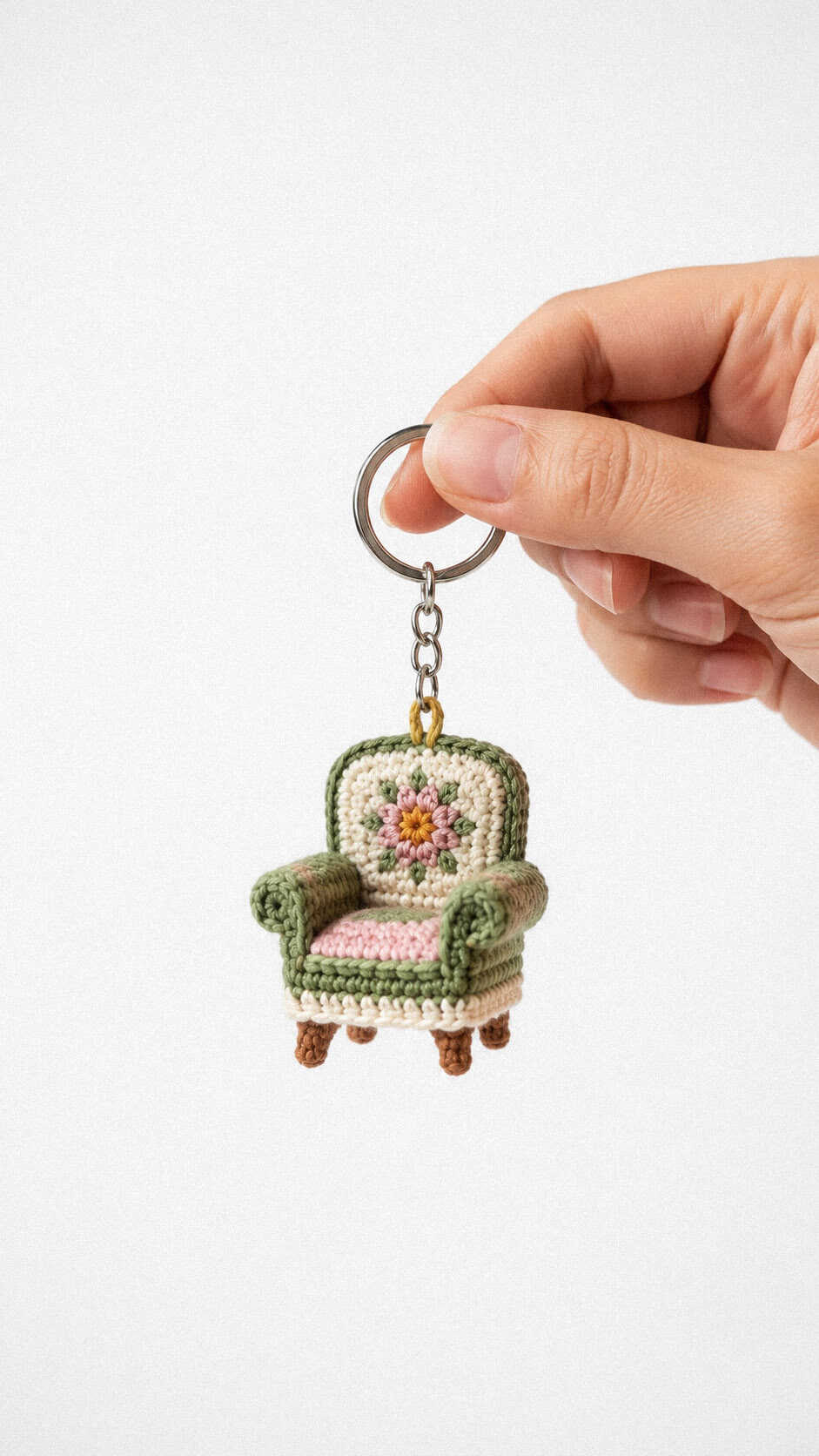 Mini crochet floral armchair keychain with pink cushion and vintage chair details free pattern